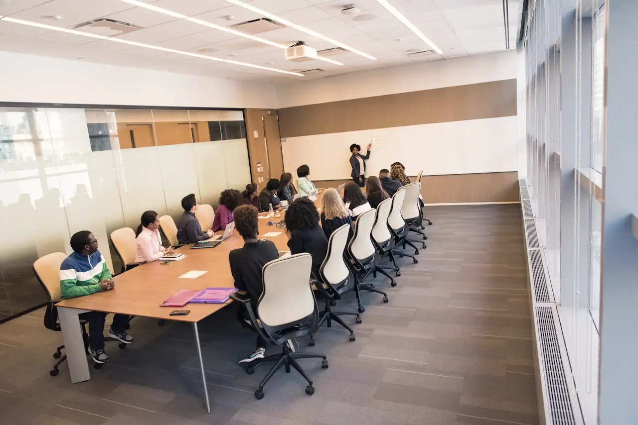 Delegates seated in a training room facing a facilitator